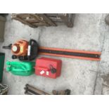 A STIHL HS 45 PETROL HEDGE TRIMMER AND TWO PETROL CANS