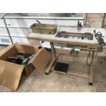 A BROTHER INDUSTRIAL SEWING MACHINE WITH TABLE AND BOBBIN HOLDERS. IN WORKING ORDER