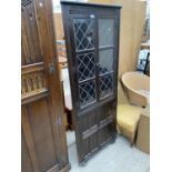 A PRIORY STYLE OAK CORNER CUPBOARD WITH TWO LOWER DOORS AND TWO UPPER LEAD GLAZED DOORS