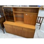 A JENTIQUE TEAK CABINET WITH THREE LOWER DOORS AND DRAWERS AND TWO UPPER DOORS