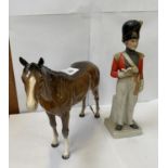 A CERAMIC HUSSAR SOLIDER FIGURE STAMPED 'REG DES' TO THE BASE TOGETHER WITH BESWICK HORSE FIGURE (