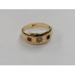 A CHILD'S 18CT YELLOW GOLD DIAMOND AND RUBIES RING, WEIGHT 2.6 G