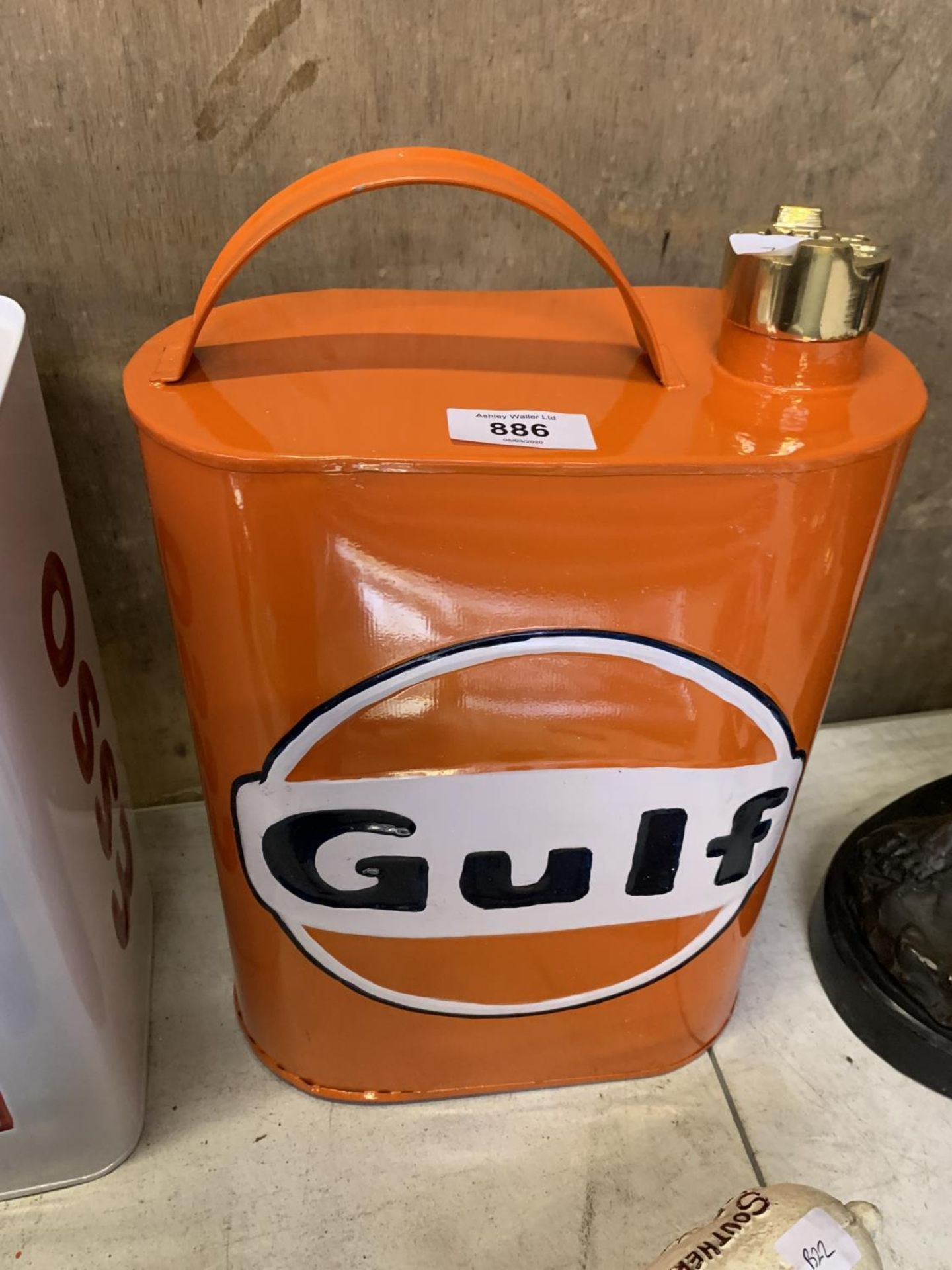 A ORANGE METAL GULF PETROL CAN