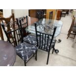 A GLASS TOPPED TABLE ON WROUGHT IRON SUPPORTS AND SIX MATCHING DINING CHAIRS