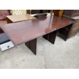 A MAHOGANY DINING TABLE