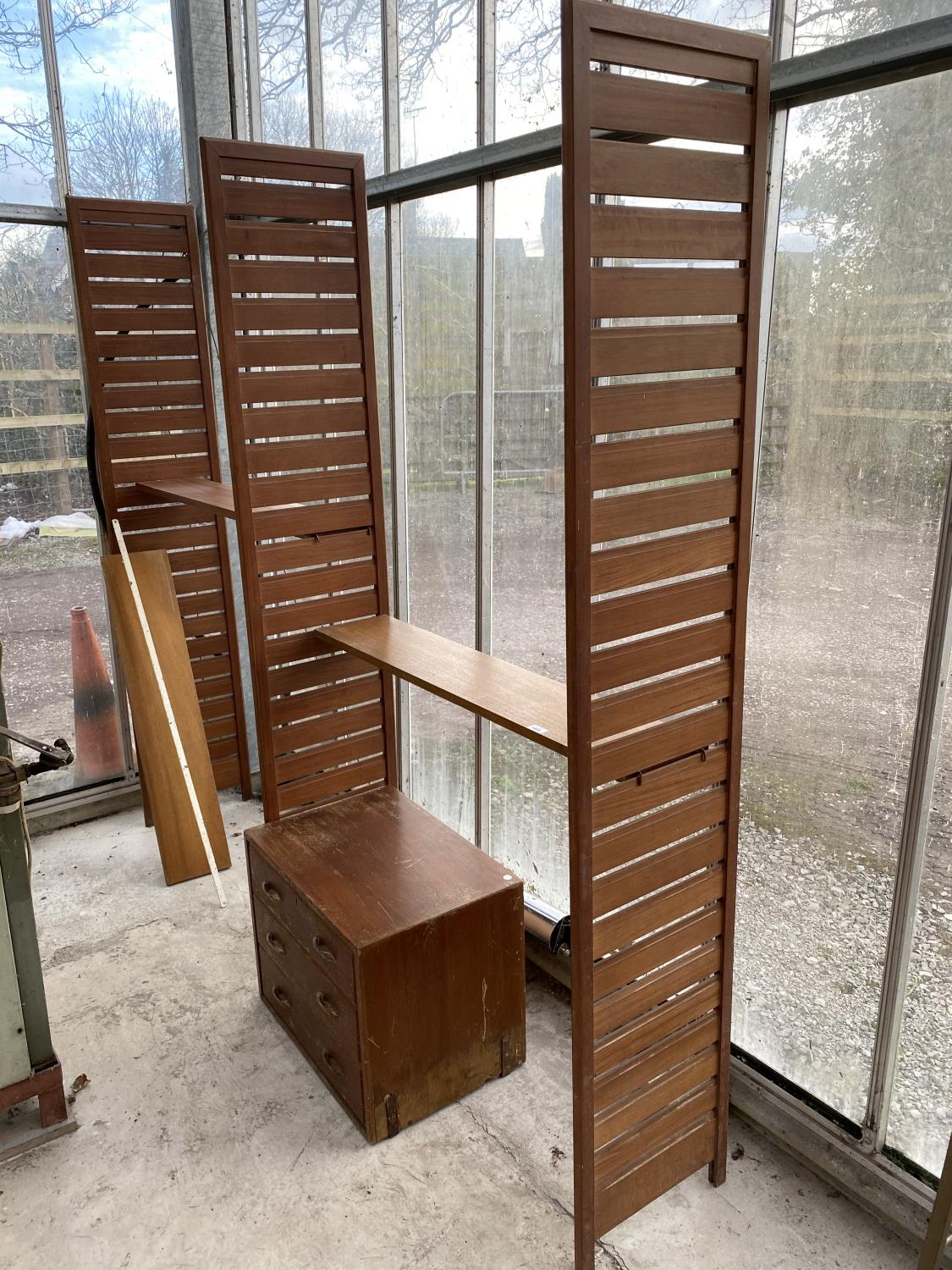 A LADDERAX TEAK DOUBLE SHELVING UNIT AND THREE DRAWER CHEST