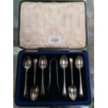 A CASED SET OF HALLMARKED SILVER TEASPOONS AND SUGAR TONGS