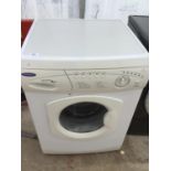 A HOTPOINT AQUARIUS WASHING MACHINE IN WORKING ORDER