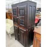 AN 18TH CENTURY OAK LARDER CUPBOARD WITH TWO LOWER DOORS AND TWO UPPER DOORS WITH TURNED STRUT