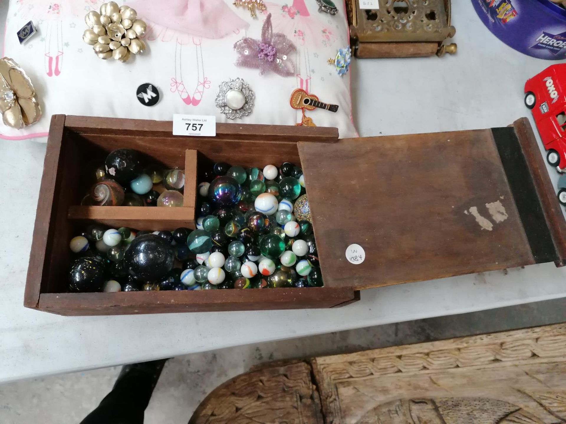 A BOX OF ASSORTED GLASS MARBLES