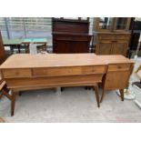 A RETRO TEAK DRESSING TABLE WITH FOUR DRAWERS AND A MATCHING BEDSIDE CABINET WITH ONE DOOR AND ONE