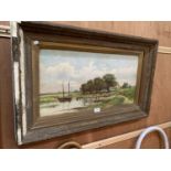 A LARGE FRAMED PAINTING OF A LAKE SCENE