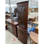 A MAHOGANY CORNER CABINET WITH LOWER DOOR AND UPPER GLAZED DOOR