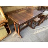 AN OAK DRAW LEAF DINING TABLE