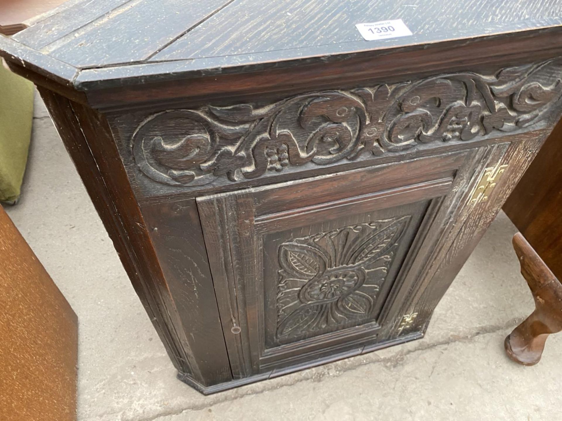AN OAK FLAT FRONT CORNER CUPBOARD WITH CARVED PANEL DOOR - Image 2 of 2