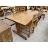 A PINE DINING TABLE AND FOUR PINE DINING CHAIRS