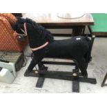 A BLACK ROCKING HORSE