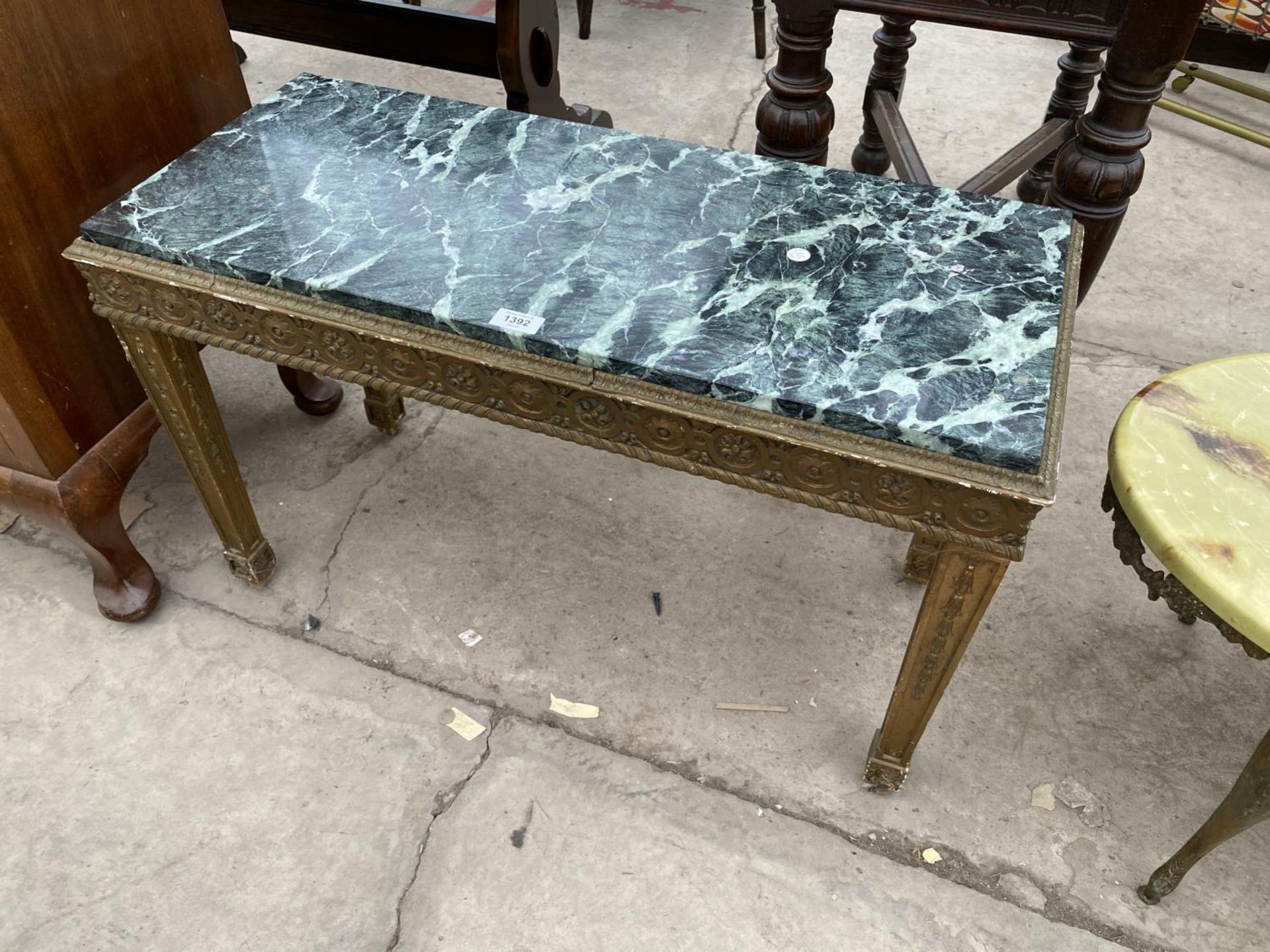 A MARBLE AND GILDED COFFEE TABLE