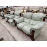 A LEATHER AND MAHOGANY TWO SEATER SOFA, TWO ARMCHAIRS AND A FOOTSTOOL