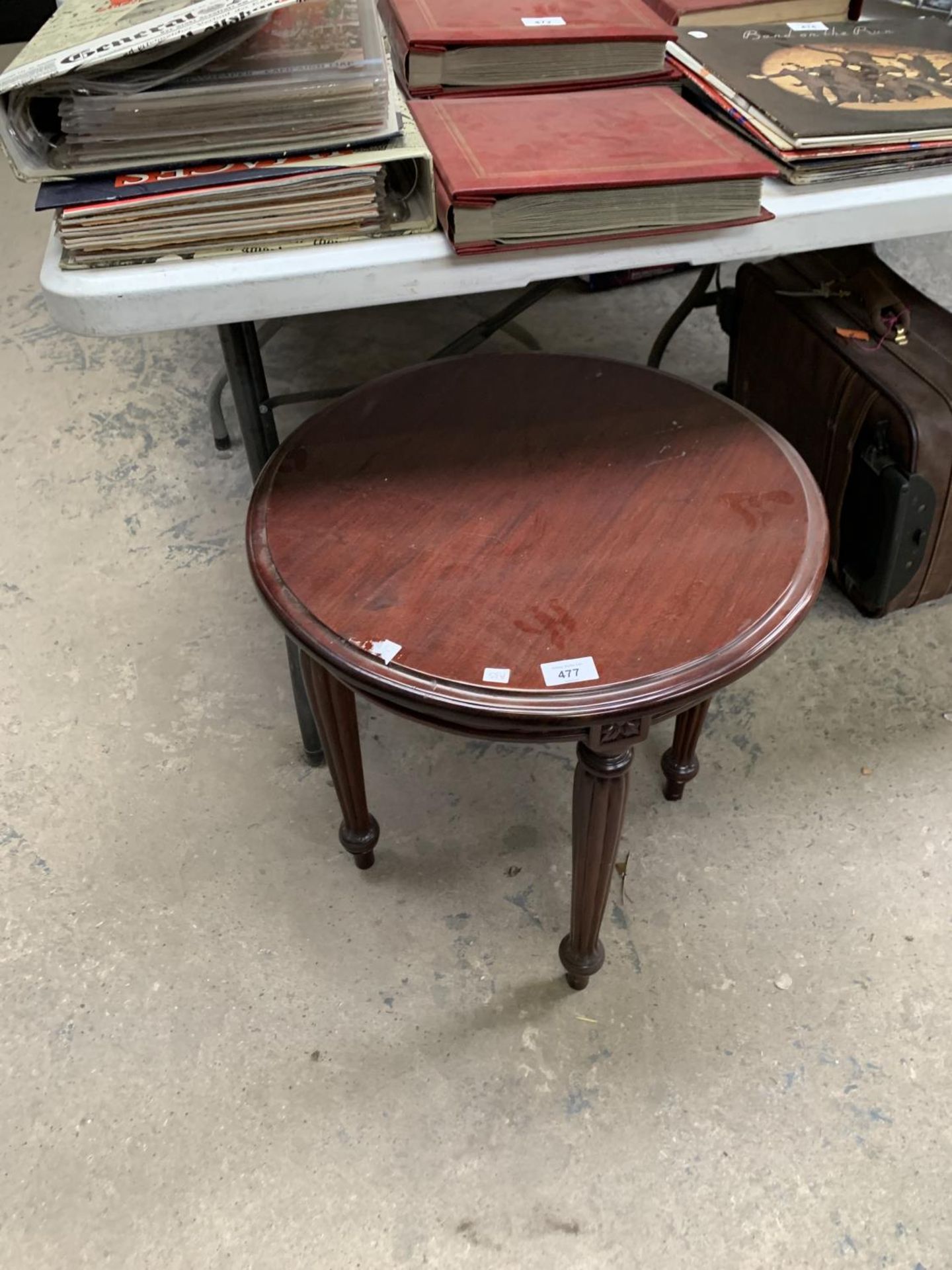 A MAHOGANY CIRCULAR SIDE TABLE WITH CARVED DETAILING TO LEGS AND SIDES