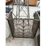 A HEAVY ORNATE METAL THREE SECTION FIRE SCREEN