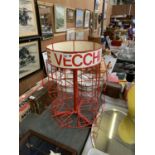 A VINTAGE RED TUBULAR METAL DISPLAY STAND