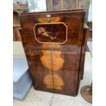 AN ORIENTAL STYLE WALNUT COCKTAIL CABINET WITH FALL FRONT AND TWO DOORS