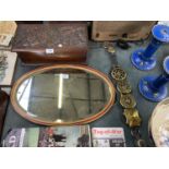 A OVAL MIRROR TOGETHER WITH A BELT AND BRASS BADGES