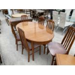 A RETRO EXTENDING TEAK DINING TABLE AND SIX TEAK DINING CHAIRS