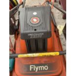 A FLYMO SPRINTMASTER XE250 LAWNMOWER AND A BOSCH ART26 COMBITRIM STRIMMER IN WORKING ORDER