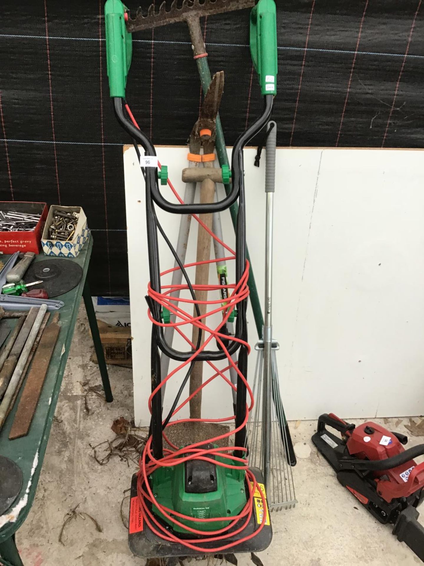 AN ELECTRIC ROTOVATOR IN WORKING ORDER AND VARIOUS GARDEN TOOLS TO INCLUDE A SPADE, FORK, RAKE ETC