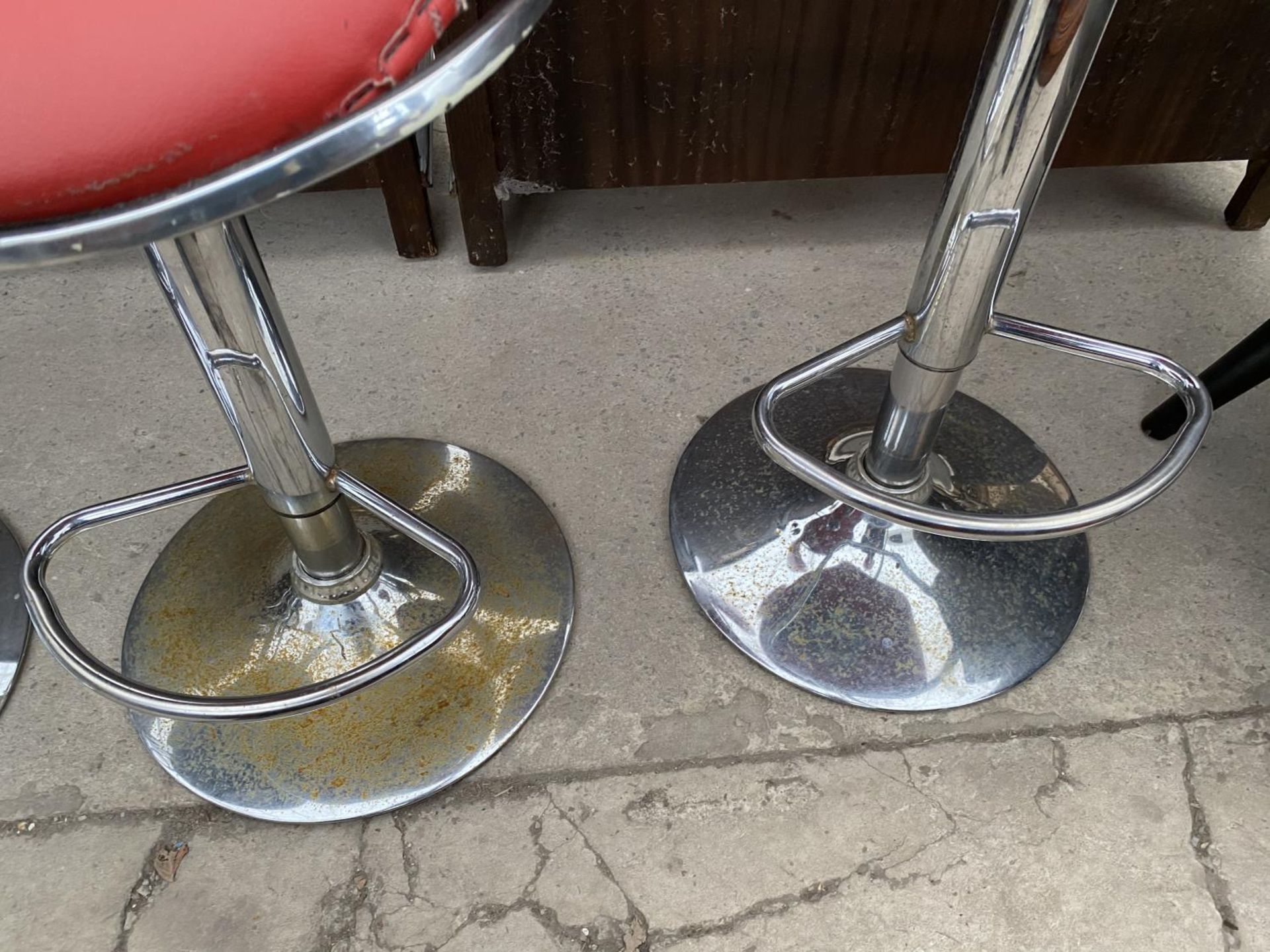 TWO RED BAR STOOLS ON CHROME SWIVEL SUPPORTS - Image 4 of 4