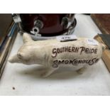 A CAST IRON BUTCHERS PIG MONEY BOX