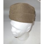 A BRITISH WAR DEPARTMENT MARKED SIDECAP AND PAIR OF PUTTEES