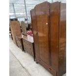 AN OAK WARDROBE, CHEST OF THREE DRAWERS AND DRESSING TABLE