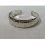 A LADIES SILVER BANGLE