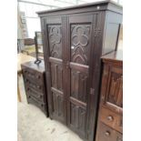 AN OAK WARDROBE WITH TWO DOORS