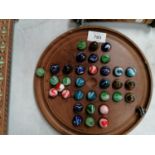 A VINTAGE SOLITAIRE / MARBLES BOARD WITH GLASS MARBLES
