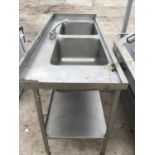 A STAINLESS STEEL DOUBLE SINK UNIT WITH MIXER TAP AND A LOWER SHELF