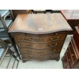 A SERPENTINE FRONT MAHOGANY CHEST OF FOUR DRAWERS WITH DRESSING SLIDE