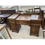 A PRIORY STYLE OAK DRESSING TABLE WITH ONE LONG AND SIX SHORT DRAWERS AND THREE SECTION MIRROR