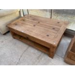 A PINE COFFEE TABLE WITH IRON STUDDED TOP