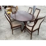 A MAHOGANY EXTENDING DINING TABLE WITH FOUR DINING CHAIRS AND TWO CARVERS