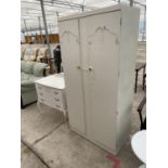 A FRENCH STYLE CREAM WARDROBE AND DRESSING TABLE WITH THREE DRAWERS AND UNFRAMED MIRROR