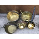 A LARGE QUANTITY OF BRASS JAM PANS, FURTHER PANS AND LADLES ETC