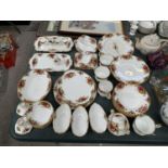 A COLLECTION OF ROYAL ALBERT OLD COUNTRY ROSES CHINA TO INCLUDE CLOCK, PLATES, BOWLS, CUPS, CANDLE