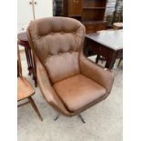 A RETRO SWIVEL ARMCHAIR