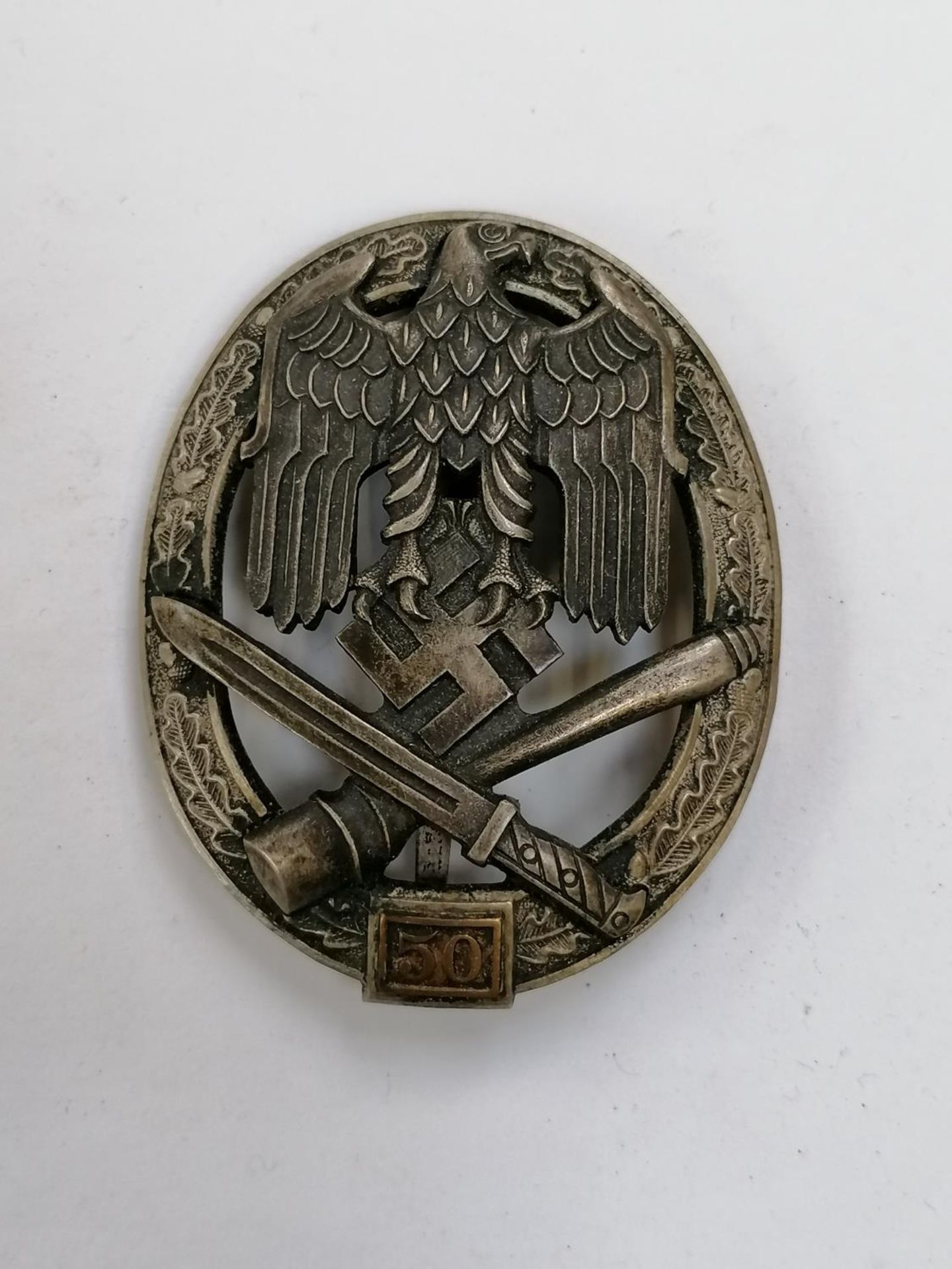 A GENERAL ASSAULT '50' BADGE