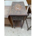 A CARVED OAK SIDE TABLE