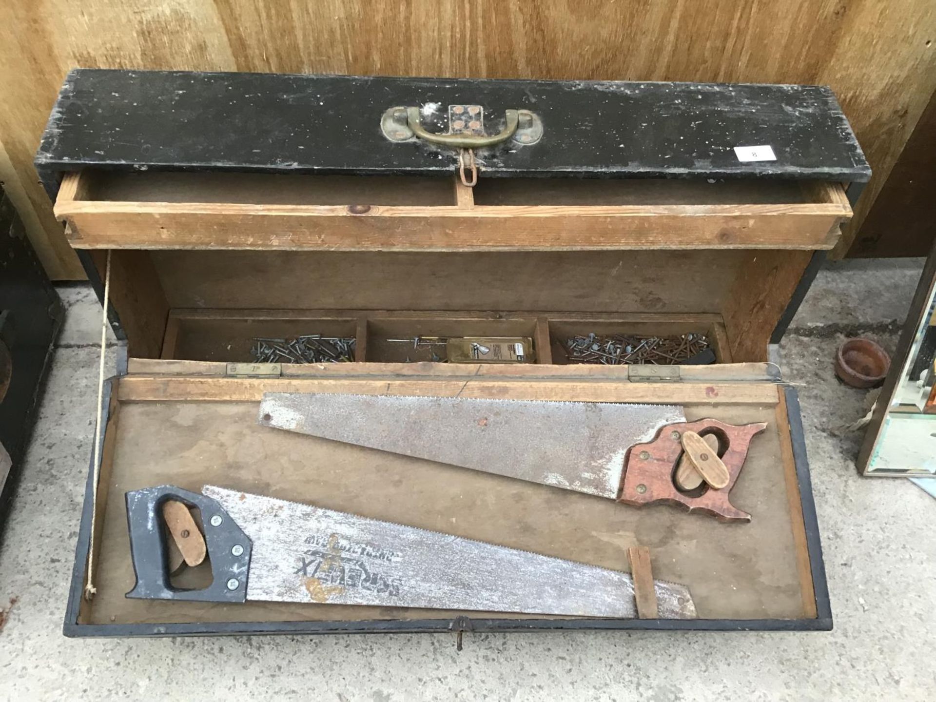 A WOODEN JOINERS CHEST WITH TOOLS